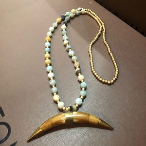 Beaded necklace with horn pendant